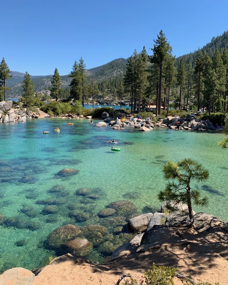 Turquoise water, granite boulders and pine trees at a cove on Lake Tahoe
